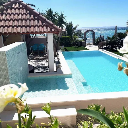 Maris- Beachfront With Exclusive Pool Вилла *