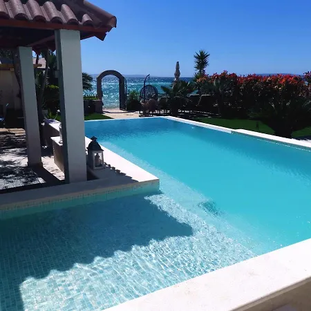 Maris- Beachfront With Exclusive Pool Вилла